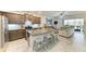 Modern kitchen with granite countertops, stainless steel appliances, and an open layout to the living area at 8676 Ice Wine St, Sarasota, FL 34238