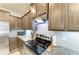 Close-up of a modern kitchen with stainless steel appliances and granite countertops at 8676 Ice Wine St, Sarasota, FL 34238