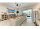 Comfortable living room featuring a large sectional sofa and sliding glass doors at 8676 Ice Wine St, Sarasota, FL 34238