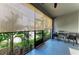Relaxing patio area with two chairs and a small table offering an outdoor view at 8676 Ice Wine St, Sarasota, FL 34238