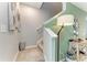 Carpeted staircase with neutral decor and stylish lighting at 8676 Ice Wine St, Sarasota, FL 34238