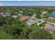 Spacious landscaped property with a pool, screened-in patio, and a view of the surrounding community at 8924 Misty Creek Dr, Sarasota, FL 34241