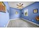 The bedroom features a ceiling fan, wood-look floors, and a window with natural light at 8924 Misty Creek Dr, Sarasota, FL 34241
