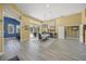 Bright dining room with elegant chandelier, table set for dinner, and sliding doors to the outdoor pool area at 8924 Misty Creek Dr, Sarasota, FL 34241