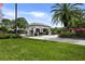Guarded community entrance with meticulously maintained landscaping, showcasing the pristine and secure environment at 8924 Misty Creek Dr, Sarasota, FL 34241
