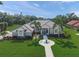 Aerial view showcasing home's manicured lawn and beautiful landscaping at 8924 Misty Creek Dr, Sarasota, FL 34241