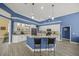 Modern kitchen featuring blue walls, white cabinetry, granite countertops, and stainless steel appliances at 8924 Misty Creek Dr, Sarasota, FL 34241