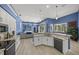 Open kitchen flows to living area with stainless appliances, granite countertops, and a view of the pool at 8924 Misty Creek Dr, Sarasota, FL 34241