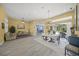 Spacious living area with tile flooring, a dining area, and access to a screened-in pool at 8924 Misty Creek Dr, Sarasota, FL 34241