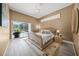 Calm main bedroom with pool view, slider door, and an elegant bed dressed in neutral tones at 8924 Misty Creek Dr, Sarasota, FL 34241