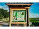 Welcome sign for Rothenbach Park, showcasing park amenities and hours at 8924 Misty Creek Dr, Sarasota, FL 34241
