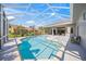 Backyard features a sparkling pool, screened-in patio, and beautiful landscaping at 8924 Misty Creek Dr, Sarasota, FL 34241