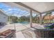 Relaxing screened-in patio with comfortable seating next to a sparkling in-ground pool at 8924 Misty Creek Dr, Sarasota, FL 34241