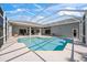 Backyard view of private pool and patio, screened in for outdoor living and entertaining at 8924 Misty Creek Dr, Sarasota, FL 34241