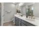 Stylish bathroom featuring dual sinks, granite countertops, and modern fixtures at 9012 Tequila Sunrise Dr, Sarasota, FL 34241