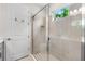 Modern bathroom highlighting a glass-enclosed shower and neutral tile at 9012 Tequila Sunrise Dr, Sarasota, FL 34241