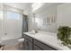 Bathroom with a modern vanity, neutral color scheme, and shower-tub combo at 9012 Tequila Sunrise Dr, Sarasota, FL 34241