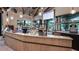 Well-stocked cafe counter displaying pastries, snacks, and drinks with a view of the pool area at 9012 Tequila Sunrise Dr, Sarasota, FL 34241