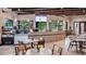 Charming cafe area with stylish countertops, elegant tables, modern appliances, and a menu board at 9012 Tequila Sunrise Dr, Sarasota, FL 34241