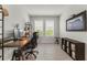 Home office with wood desk, ergonomic chair, and shelving for storage at 9012 Tequila Sunrise Dr, Sarasota, FL 34241