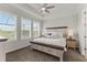 Tranquil main bedroom with ample natural light and an elegant tray ceiling at 9012 Tequila Sunrise Dr, Sarasota, FL 34241