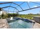 Scenic screened-in pool and spa with view of the preserve and landscaping, creating a private retreat at 9012 Tequila Sunrise Dr, Sarasota, FL 34241