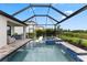 Beautiful screened-in pool and spa with a scenic view, offering a serene outdoor living space at 9012 Tequila Sunrise Dr, Sarasota, FL 34241