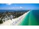 Stunning aerial view of the coastline, showcasing the beautiful beach, ocean, and nearby community at 9122 16Th Avenue Nw Cir, Bradenton, FL 34209