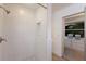 Tiled shower with a window to the vanity and dressing room at 9122 16Th Avenue Nw Cir, Bradenton, FL 34209
