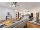Open-concept living space showcasing the kitchen with a black and white floor, modern furnishings, and ample lighting at 9122 16Th Avenue Nw Cir, Bradenton, FL 34209
