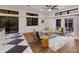 Bright living room features hardwood floors, modern decor, and sliding glass doors to outdoor space at 9122 16Th Avenue Nw Cir, Bradenton, FL 34209