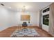 Bright home office with hardwood floors, natural light, and a contemporary glass desk at 9122 16Th Avenue Nw Cir, Bradenton, FL 34209