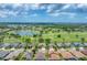 Panoramic aerial view featuring a neighborhood with ponds, set among verdant surroundings at 9123 Raes Creek Pl, Palmetto, FL 34221