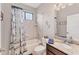Nautical-themed bathroom features tub, shower, and granite countertop vanity at 9123 Raes Creek Pl, Palmetto, FL 34221
