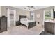 Comfortable bedroom with neutral tones, plush carpeting, and plenty of natural light at 9123 Raes Creek Pl, Palmetto, FL 34221