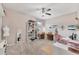 Spacious craft room featuring a ceiling fan, sewing station and multiple workstations at 9123 Raes Creek Pl, Palmetto, FL 34221