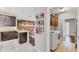 Modern kitchen and laundry area featuring stainless steel appliances and open design concept at 9123 Raes Creek Pl, Palmetto, FL 34221