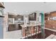 Spacious kitchen with wood cabinets, granite countertops, and a breakfast bar with seating at 9123 Raes Creek Pl, Palmetto, FL 34221