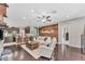 Inviting living room showcasing a wood accent wall, hardwood floors, and stylish furniture at 9123 Raes Creek Pl, Palmetto, FL 34221
