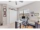Office space features built in shelving, transom window, and plush carpeting at 9123 Raes Creek Pl, Palmetto, FL 34221