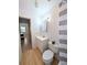 Bathroom featuring a sink, toilet, linoleum floors and a shower-tub combo at 1540 Pleasant Rd # G35, Bradenton, FL 34207