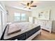 Bedroom featuring wood floors, a ceiling fan, and two dressers at 1540 Pleasant Rd # G35, Bradenton, FL 34207