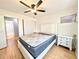 Bedroom featuring wood floors, a ceiling fan, and a small window at 1540 Pleasant Rd # G35, Bradenton, FL 34207
