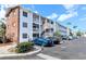Condo complex featuring white exterior, brick accents and ample parking at 1540 Pleasant Rd # G35, Bradenton, FL 34207