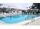 Inviting community pool area with lounge chairs and tables for residents enjoyment at 1540 Pleasant Rd # G35, Bradenton, FL 34207