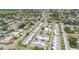 Scenic aerial shot of a neighborhood community featuring mature landscaping, a community pool and easy street access at 1060 Cockrill St # 1060, Venice, FL 34285
