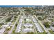 Overhead view of the neighborhood highlighting the well-maintained lawns, community pool, and consistent architectural style at 1060 Cockrill St # 1060, Venice, FL 34285