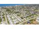Panoramic aerial view showcasing the coastal neighborhood with a pool, tennis court, and proximity to the beach at 1060 Cockrill St # 1060, Venice, FL 34285
