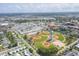 An aerial view displays a well-planned community near sports fields and waterfront at 1060 Cockrill St # 1060, Venice, FL 34285