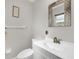 Clean bathroom featuring white cabinetry, a modern faucet, and neutral decor at 1060 Cockrill St # 1060, Venice, FL 34285